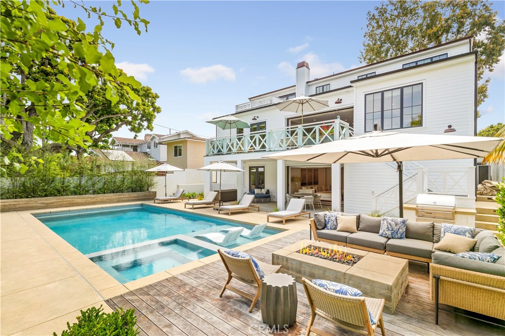 625 St James Road Newport Beach, CA 92663 - Photo 25 of 47 a view of a patio with swimming pool table and chairs