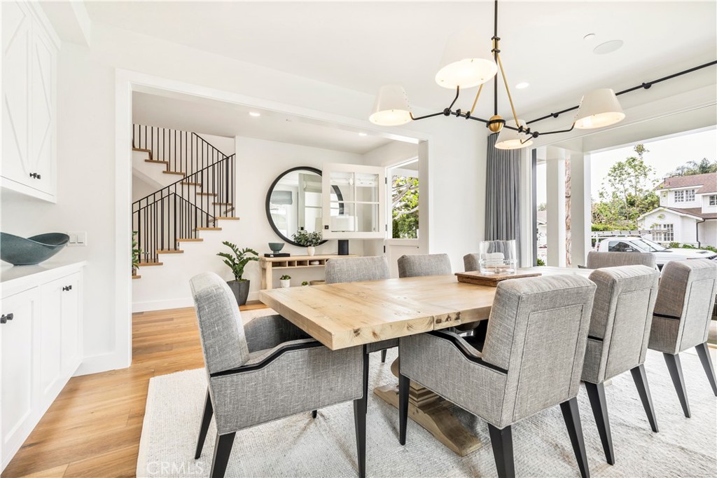 625 St James Road Newport Beach, CA 92663 - Photo 3 of 47 a view of a dining room with furniture window and wooden floor