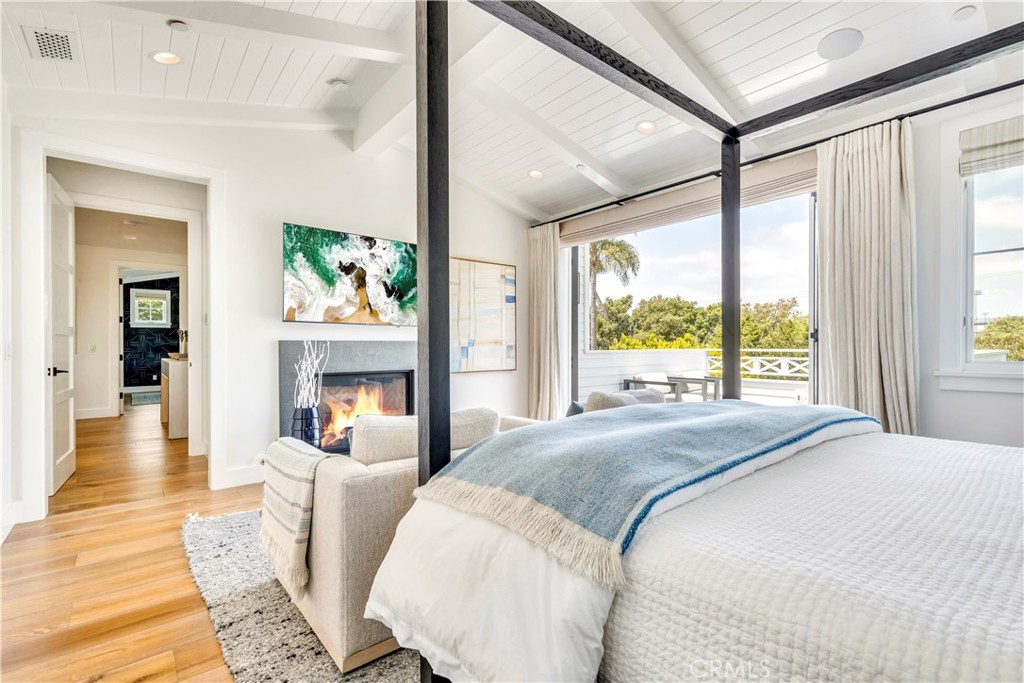 625 St James Road Newport Beach, CA 92663 - Photo 31 of 47 a spacious bedroom with a large bed and a large window