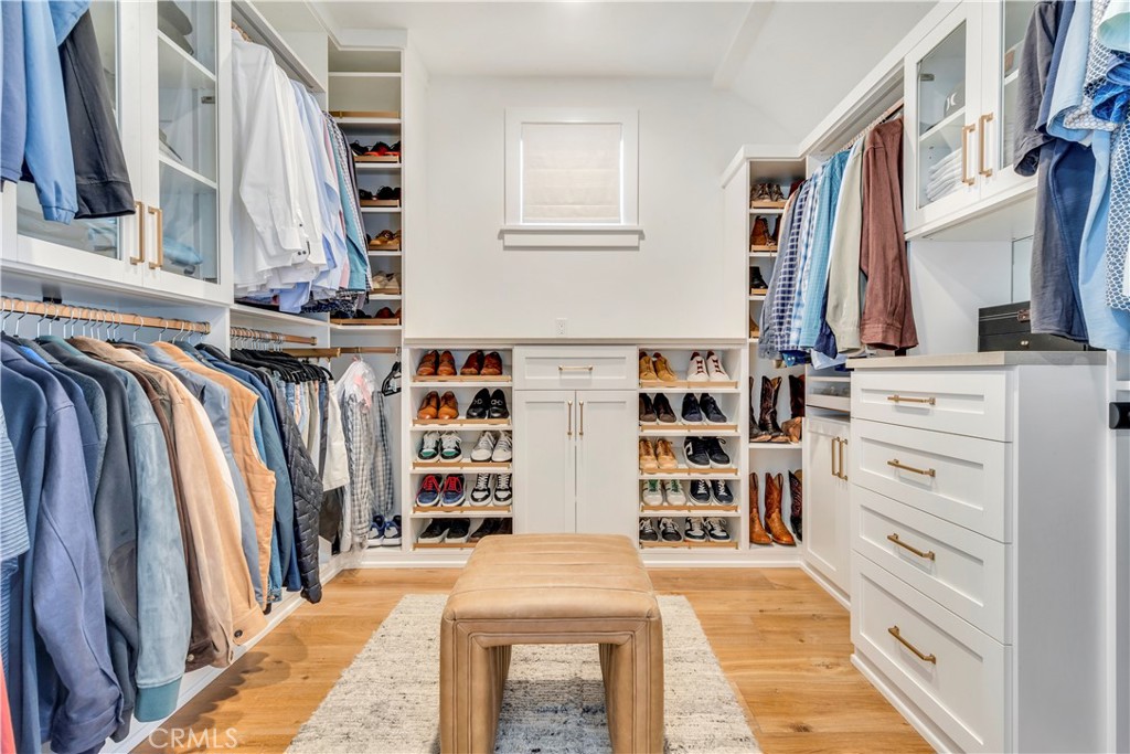 625 St James Road Newport Beach, CA 92663 - Photo 36 of 47 a view of walk in closet with clothes and shoes