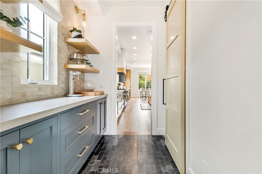 625 St James Road Newport Beach, CA 92663 - Photo 6 of 47 a bathroom with a sink mirror and a shower