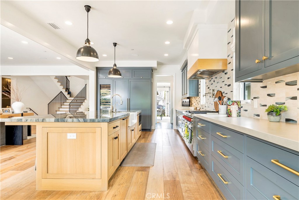 625 St James Road Newport Beach, CA 92663 - Photo 9 of 47 a large kitchen with stainless steel appliances kitchen island granite countertop a sink and cabinets