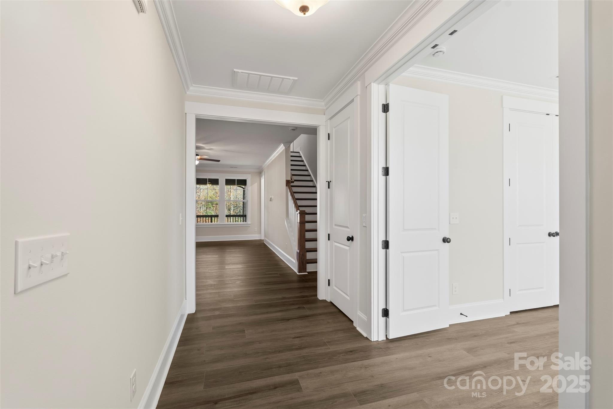 648 Digby Road, Unit 492 Rock Hill, SC 29730 - Photo 12 of 47 a view of a hallway with wooden floor and staircase