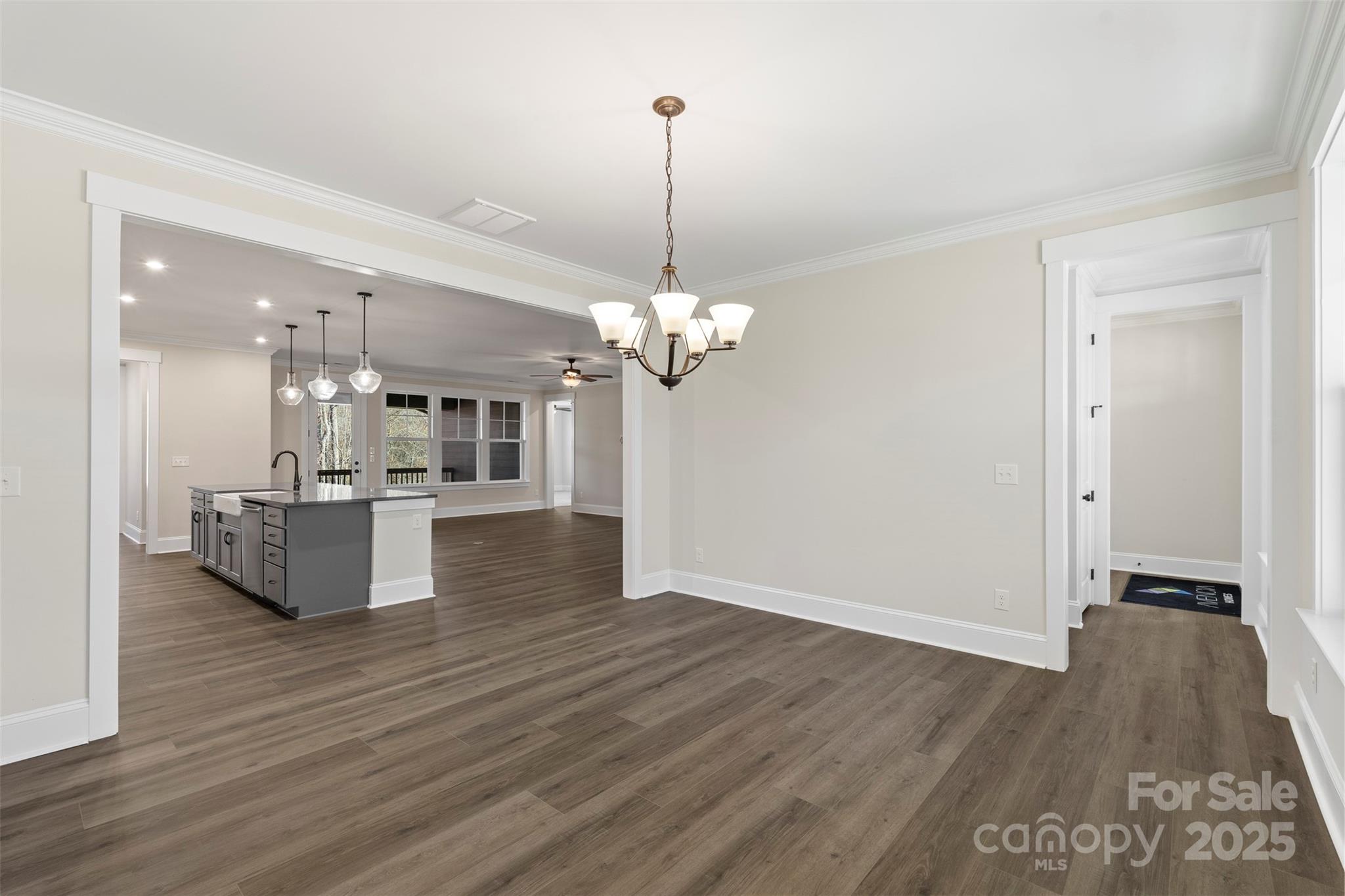 648 Digby Road, Unit 492 Rock Hill, SC 29730 - Photo 25 of 47 a room with kitchen island stainless steel appliances and wooden floor