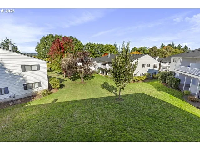 a view of a house with a big yard