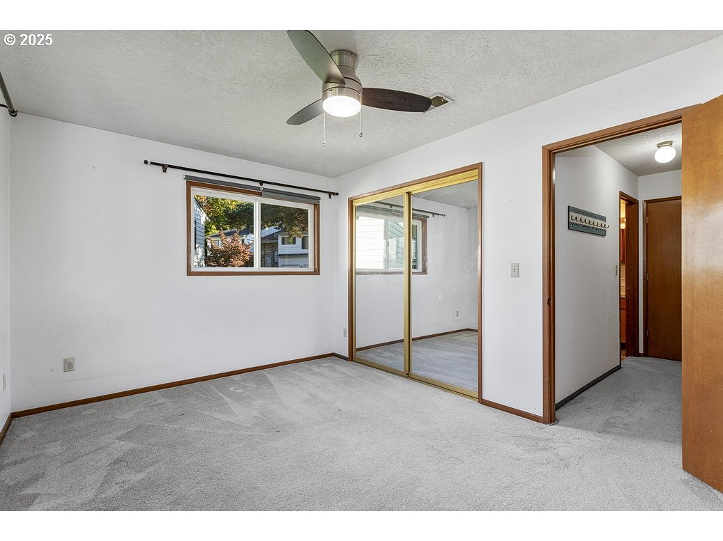 14850 Northeast Rose Parkway, Unit 67A Portland, OR 97230 - Photo 23 of 33 a view of an empty room with a window
