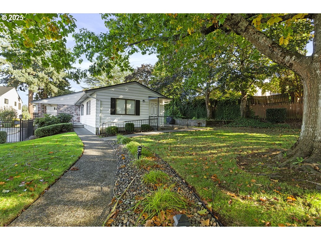 14850 Northeast Rose Parkway, Unit 67A Portland, OR 97230 - Photo 27 of 33 a view of a house with a yard