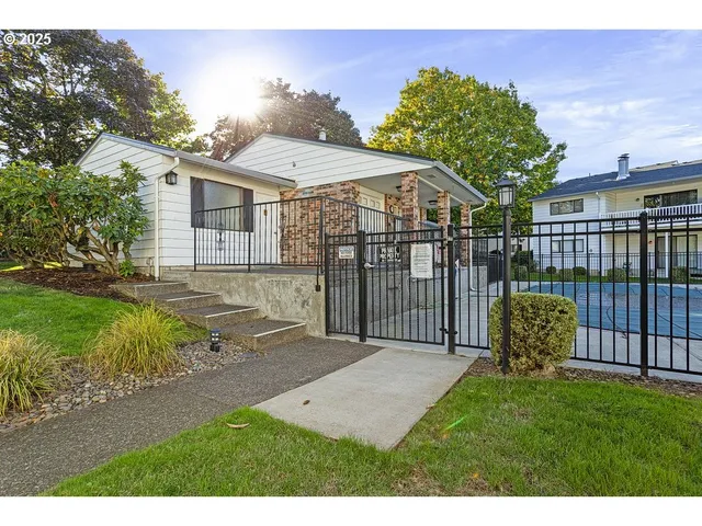 a view of a backyard with a garden and plants