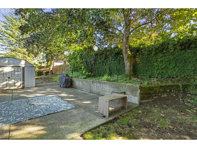 a backyard of a house with trees and outdoor