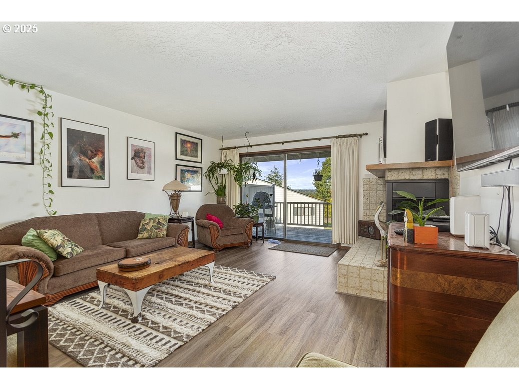 14850 Northeast Rose Parkway, Unit 67A Portland, OR 97230 - Photo 4 of 33 a living room with furniture and a window