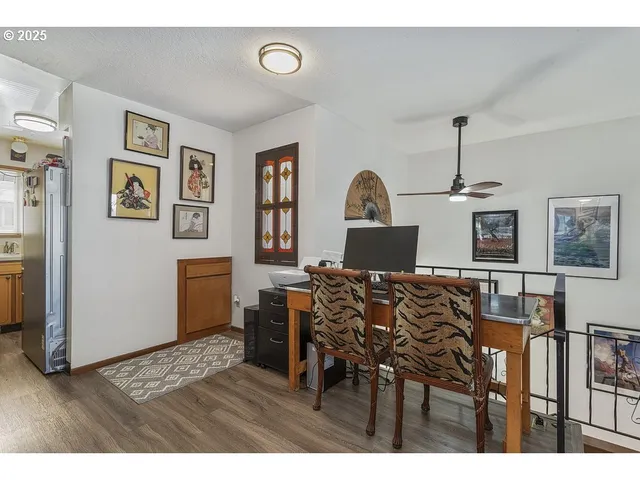 a view of a livingroom with furniture wooden floor and window