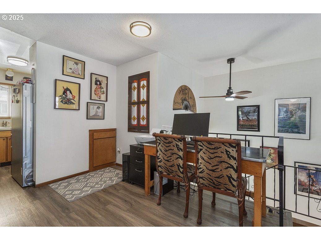 14850 Northeast Rose Parkway, Unit 67A Portland, OR 97230 - Photo 7 of 33 a view of a livingroom with furniture wooden floor and window