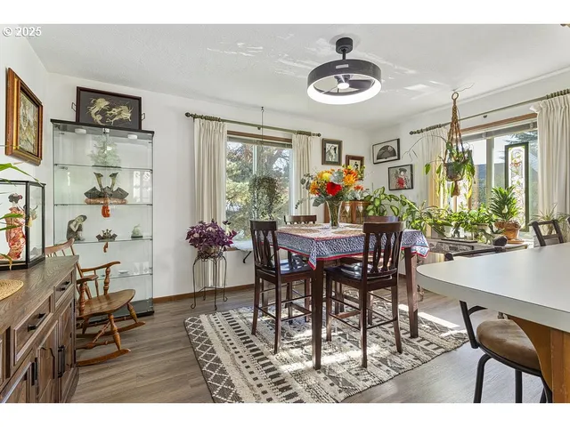 a dining room with furniture and window