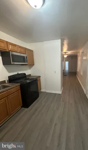 a kitchen with a stove and a microwave