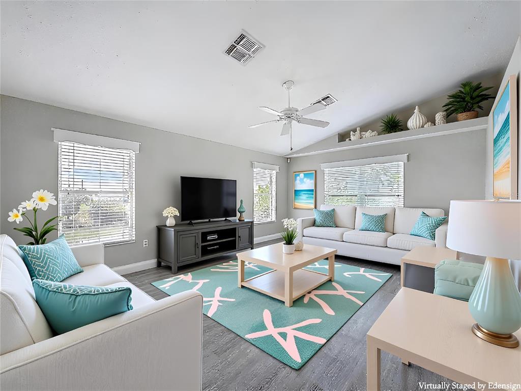 3342 Turks Cap Drive Hernando Beach, FL 34607 - Photo 27 of 100 a living room with furniture and a flat screen tv