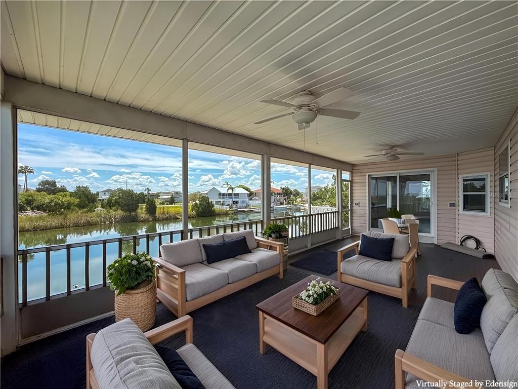 3342 Turks Cap Drive Hernando Beach, FL 34607 - Photo 29 of 94 a living room with furniture and a large window
