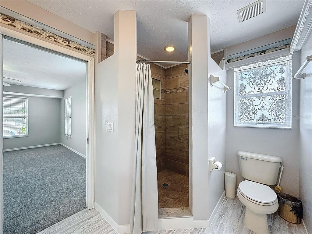 3342 Turks Cap Drive Hernando Beach, FL 34607 - Photo 55 of 94 a bathroom with a toilet shower and a sink