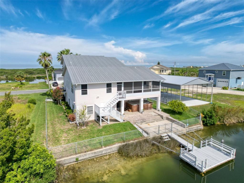 3342 Turks Cap Drive Hernando Beach, FL 34607 - Photo 70 of 100 an aerial view of a house with swimming pool garden view and a lake view