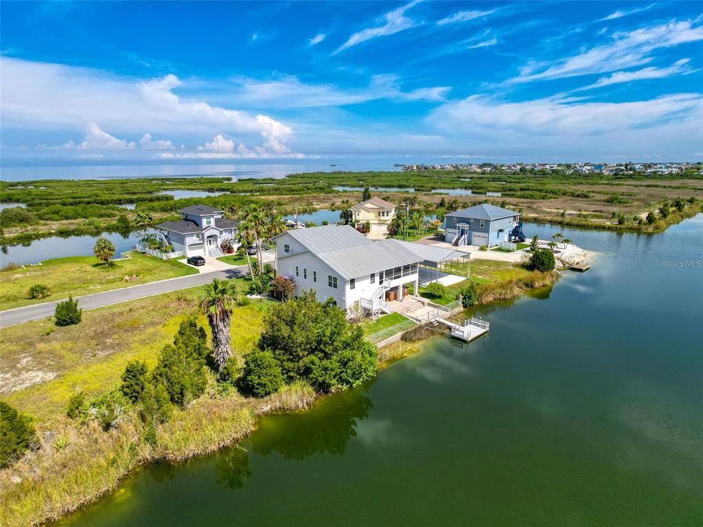 3342 Turks Cap Drive Hernando Beach, FL 34607 - Photo 87 of 94 a view of a lake with houses in the back