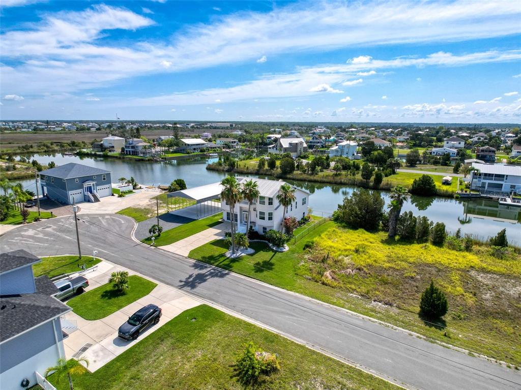 3342 Turks Cap Drive Hernando Beach, FL 34607 - Photo 92 of 94 an aerial view of a house with a lake view