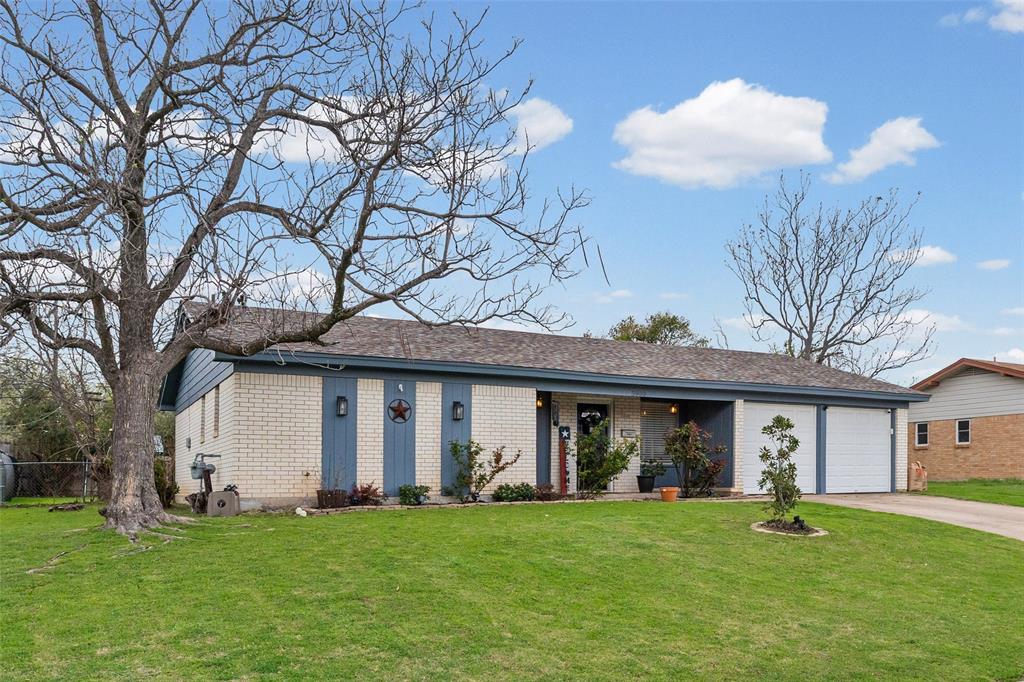 3900 Cresthill Road Benbrook, TX 76116 - Photo 1 of 18 a view of a brick house with a big yard and large trees