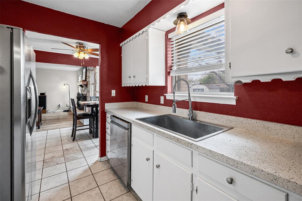 3900 Cresthill Road Benbrook, TX 76116 - Photo 5 of 18 a kitchen with a sink and cabinets