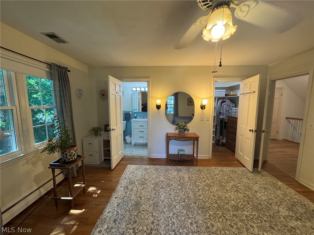 296 Fairfield Road Painesville, OH 44077 - Photo 26 of 48 HView off bedroom with hardwood flooring, walk in closet and full bath