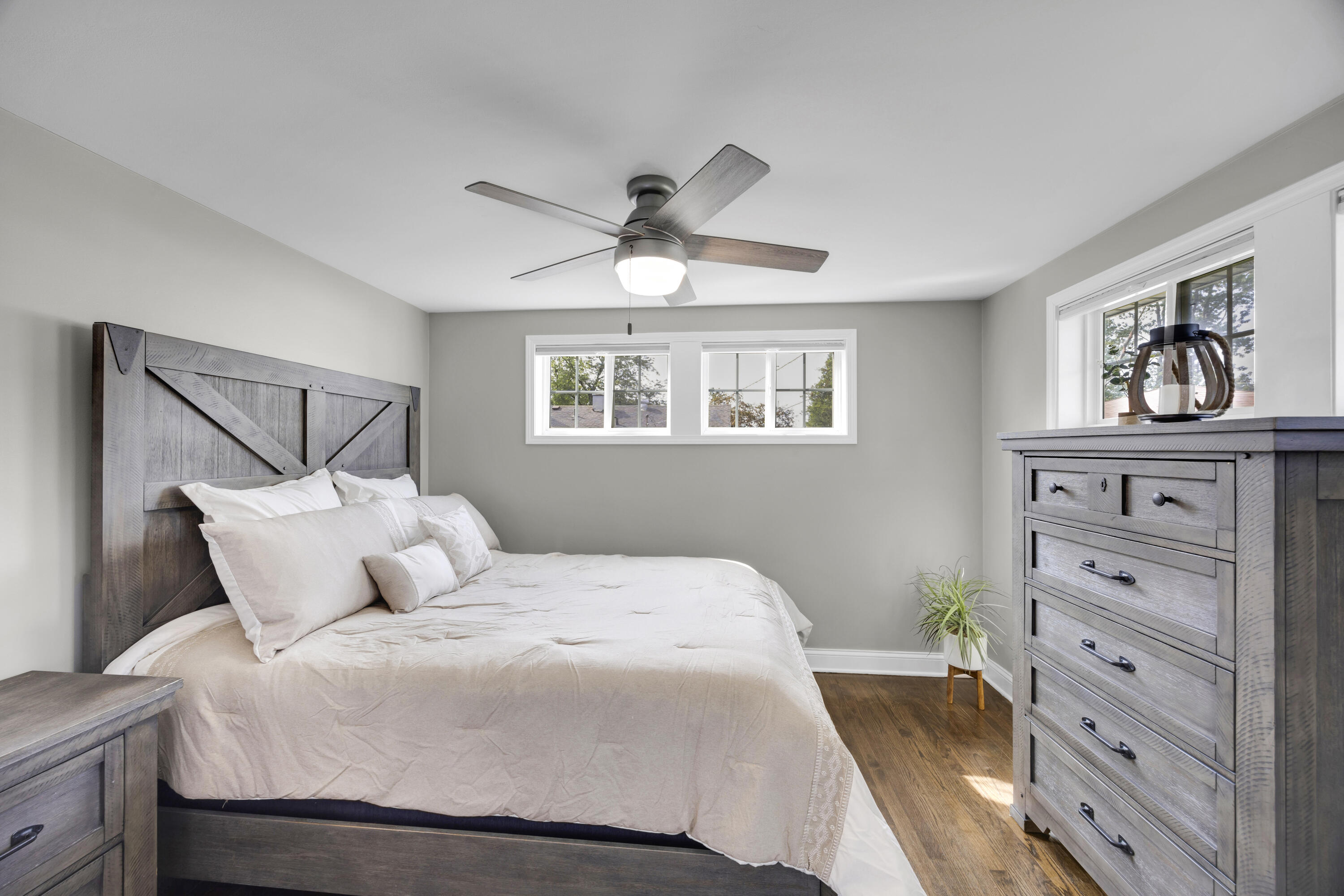 549 Ridgelawn Street Crown Point, IN 46307 - Photo 11 of 18 a bedroom with a large bed and a window