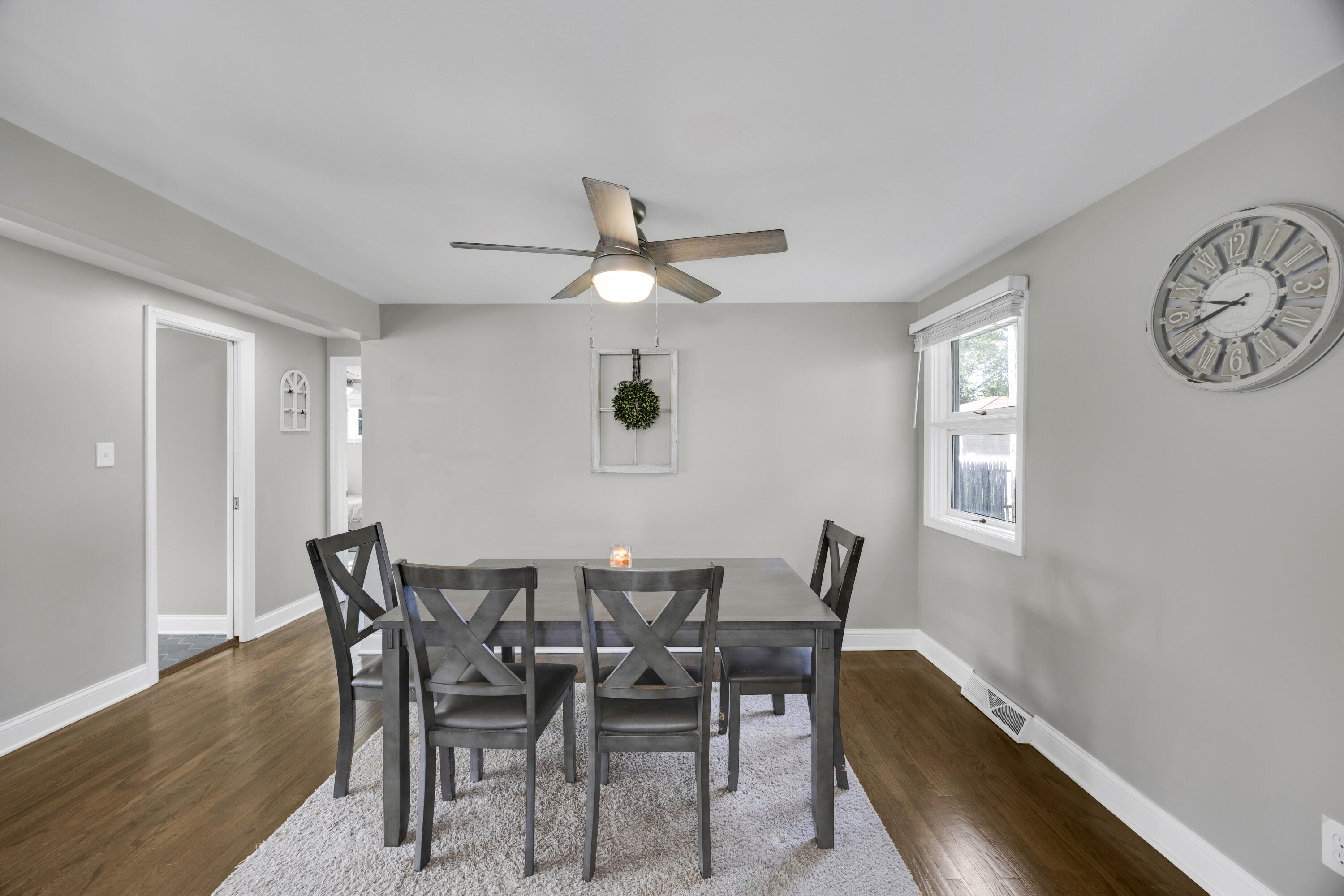 549 Ridgelawn Street Crown Point, IN 46307 - Photo 8 of 18 a view of a dining room with furniture and a chandelier