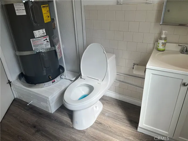 a bathroom with a toilet and a sink