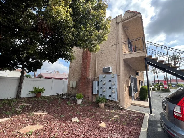 a view of a house with a tree
