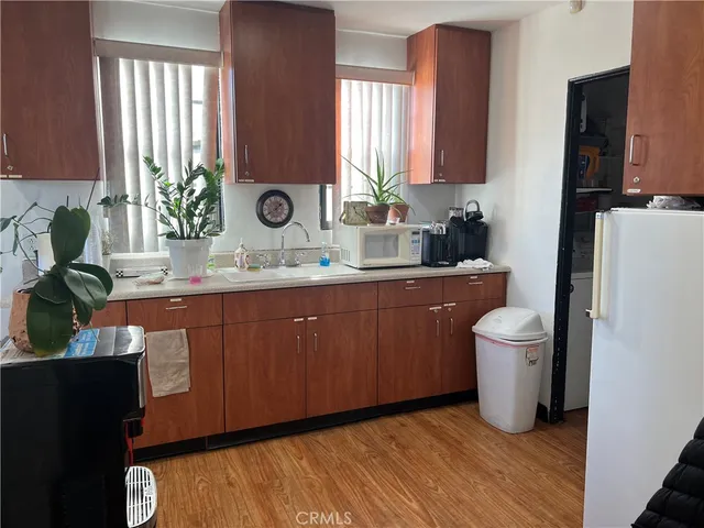 a bathroom with a sink a toilet and a window