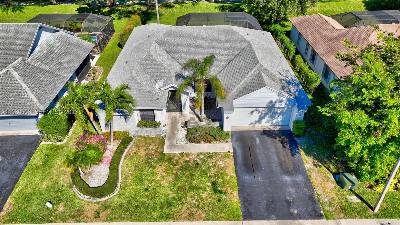 18352 181st Circle South Boca Raton, FL 33498 - Photo 2 of 13 an aerial view of a house with large trees
