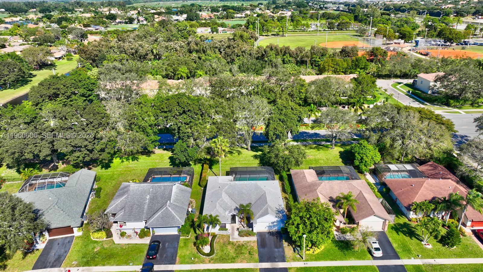 18352 181st Circle South Boca Raton, FL 33498 - Photo 4 of 13 an aerial view of residential houses with outdoor space and street view
