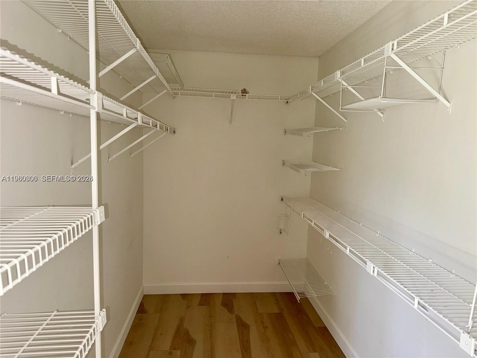 18352 181st Circle South Boca Raton, FL 33498 - Photo 9 of 13 a view of a room with racks on the wall