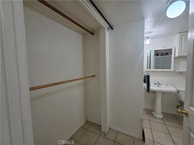 a bathroom with a sink toilet and mirror