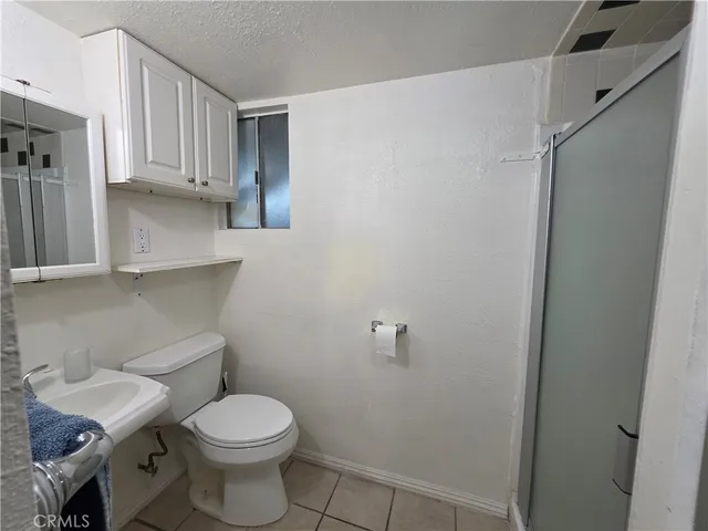 a bathroom with a toilet and a sink