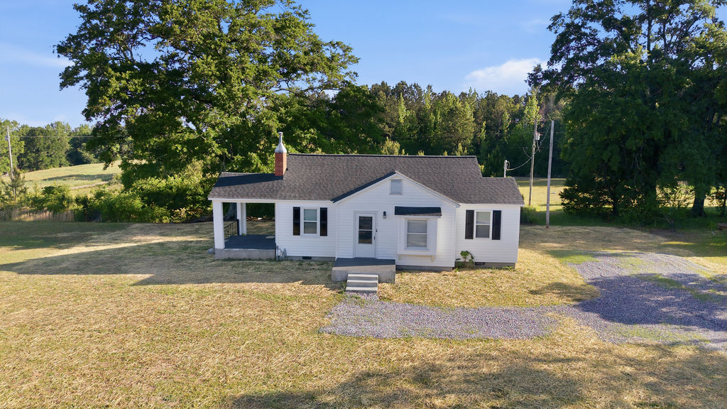 7604 Highway 252 Honea Path, SC 29654 - Photo 2 of 33 This charming home offers a tranquil escape surrounded by lush greenery and expansive outdoor space.