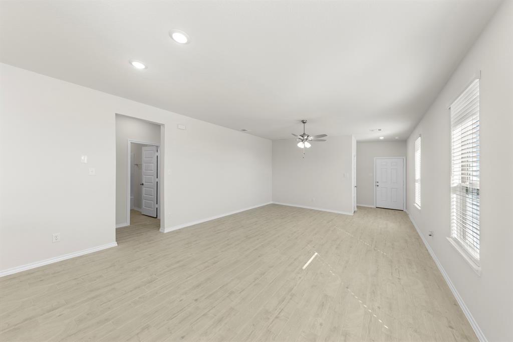 125 Pheasant Run Road Terrell, TX 75160 - Photo 13 of 27 wooden floor in an empty room with a window