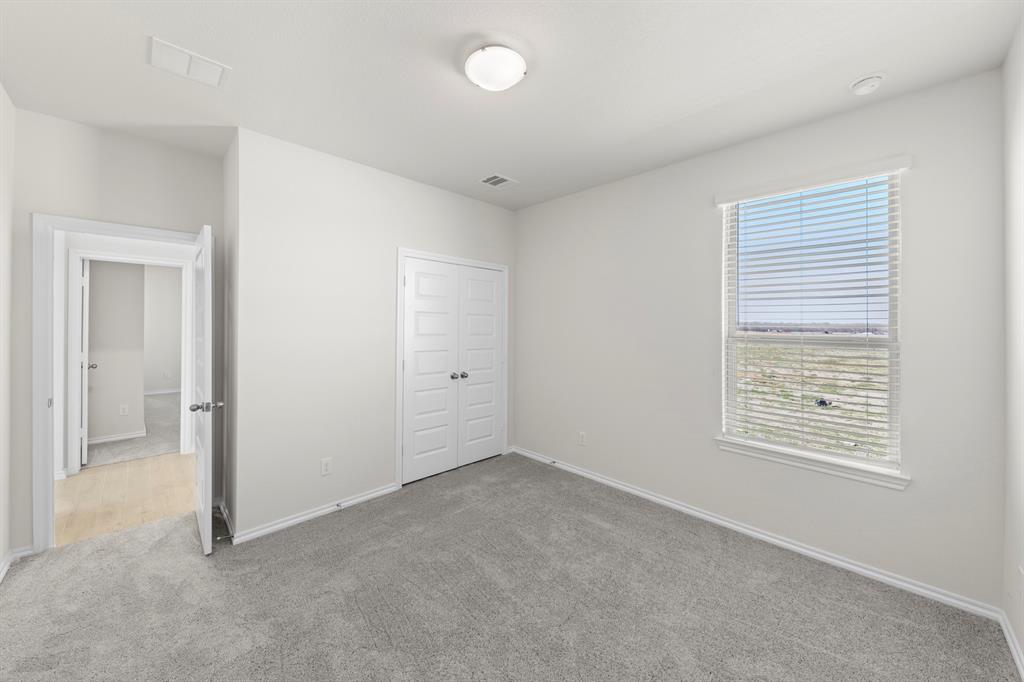 125 Pheasant Run Road Terrell, TX 75160 - Photo 15 of 27 an empty room with windows