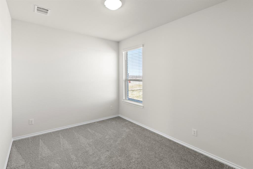 125 Pheasant Run Road Terrell, TX 75160 - Photo 16 of 27 an empty room with a window