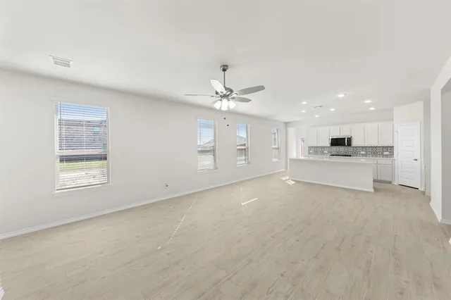 a view of a kitchen with a sink cabinets and window