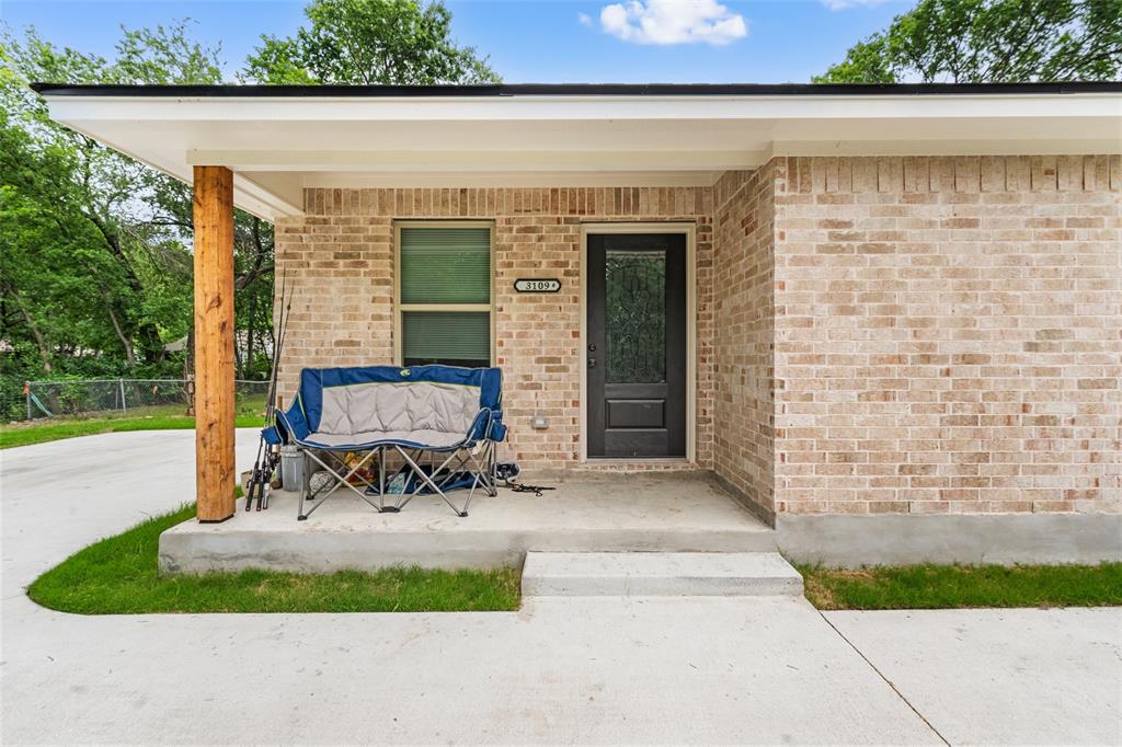 3109 North 27th Street Waco, TX 76708 - Photo 3 of 17 a view of a patio with table and chairs with wooden fence