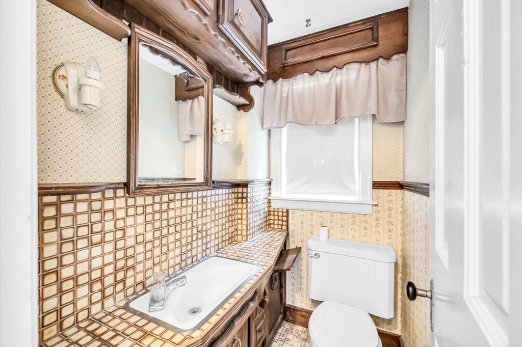 55 Pasadena Street Springfield, MA 01108 - Photo 13 of 33 a bathroom with a sink toilet and shower