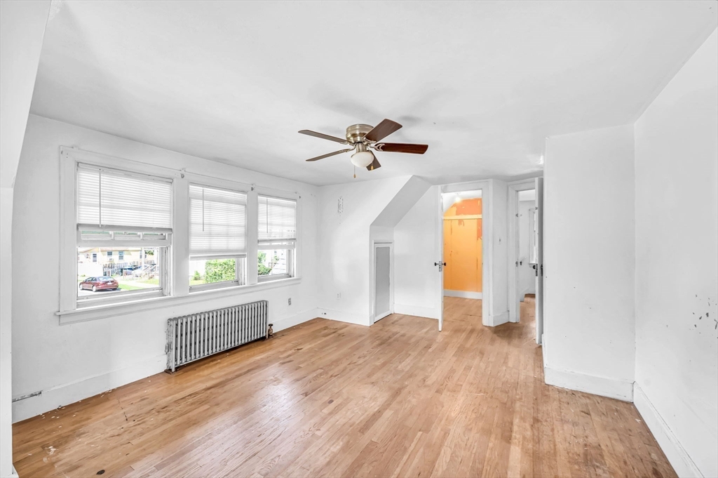 55 Pasadena Street Springfield, MA 01108 - Photo 20 of 33 wooden floor in an empty room with a window