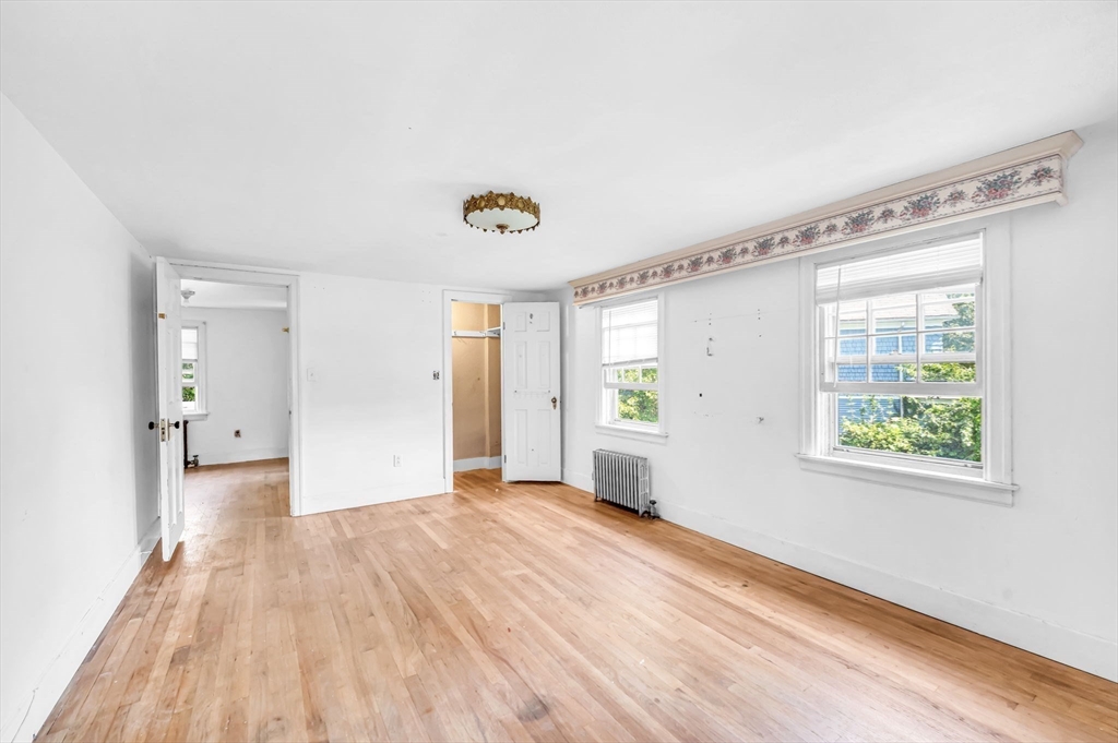 55 Pasadena Street Springfield, MA 01108 - Photo 21 of 33 a view of an empty room with wooden floor and a window
