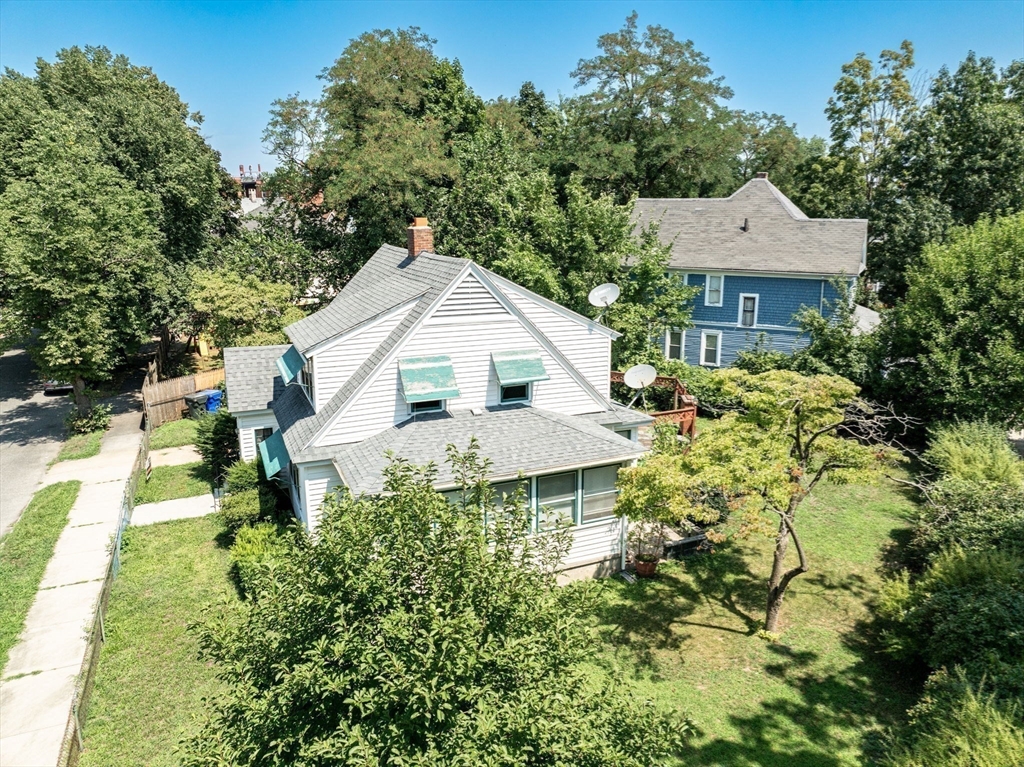 55 Pasadena Street Springfield, MA 01108 - Photo 30 of 33 a aerial view of a house with a yard and potted plants