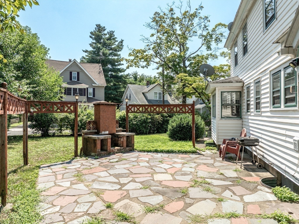 55 Pasadena Street Springfield, MA 01108 - Photo 4 of 33 a view of a house with backyard and sitting area