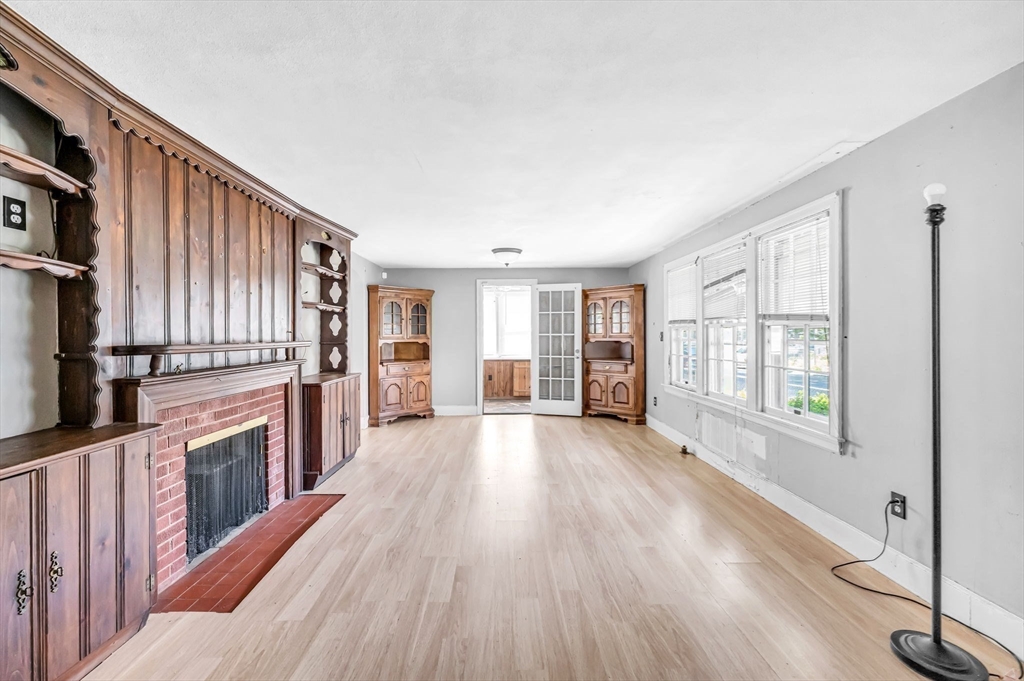 55 Pasadena Street Springfield, MA 01108 - Photo 6 of 33 a view of an empty room with wooden floor and a window