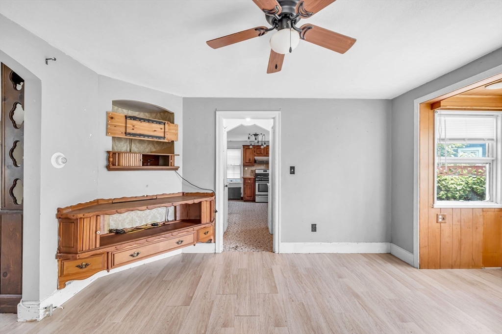 55 Pasadena Street Springfield, MA 01108 - Photo 10 of 33 an empty room with windows and ceiling fan